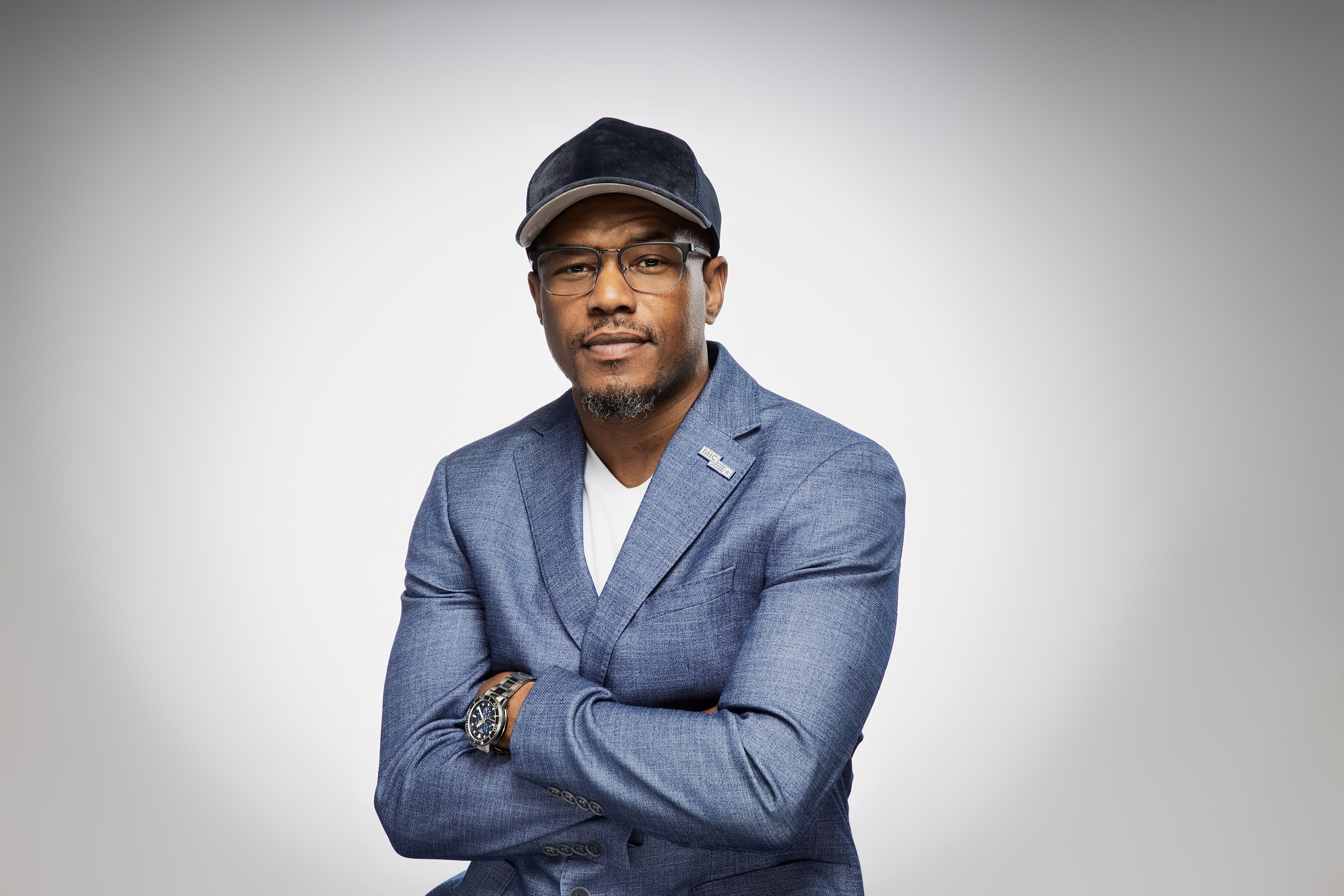 Curtez Riggs — arms crossed headshot