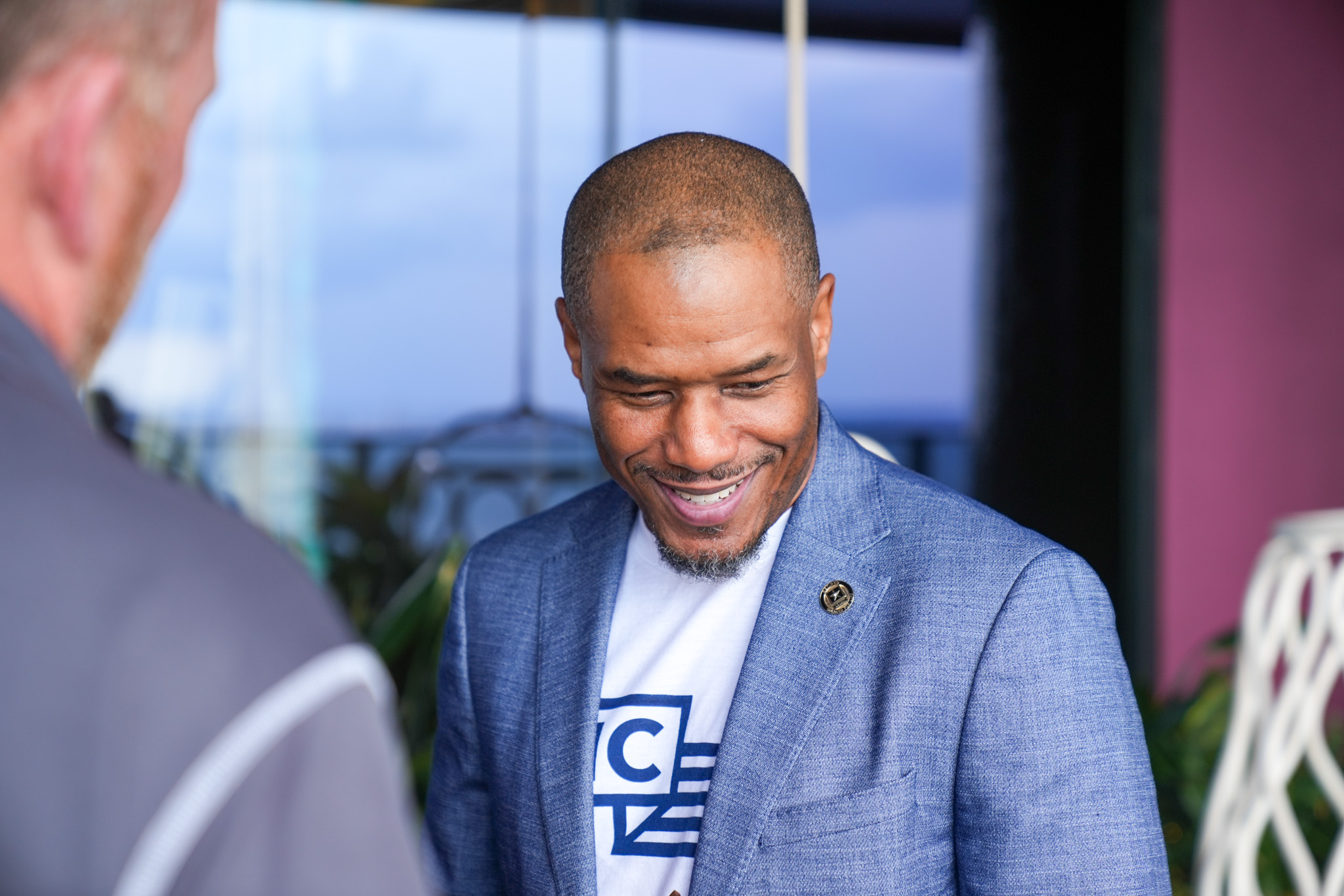 Curtez Riggs laughing in conversation