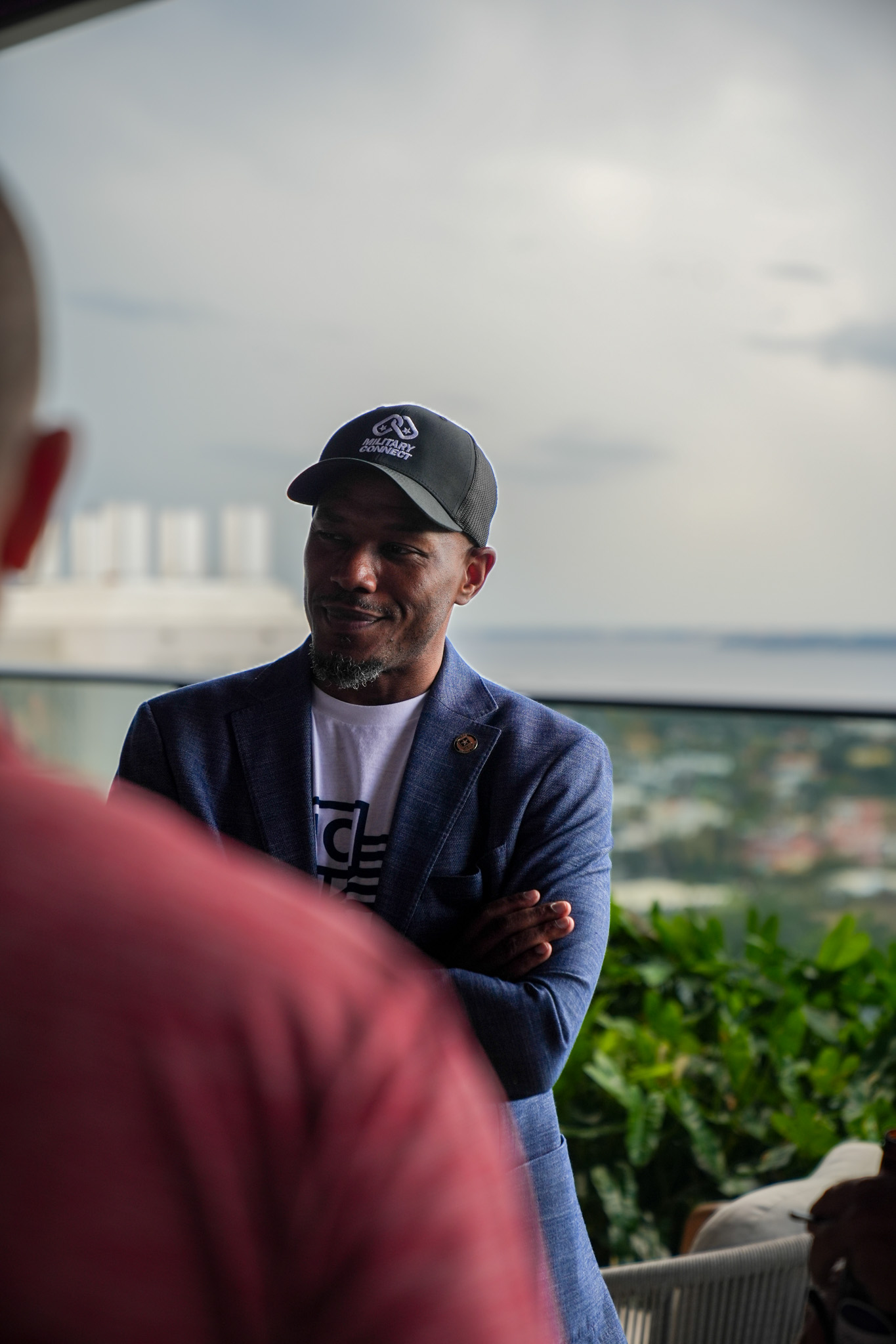 Curtez Riggs in conversation on a rooftop in Tampa